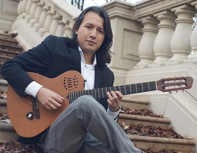 Diego Salcedo performing live on guitar
